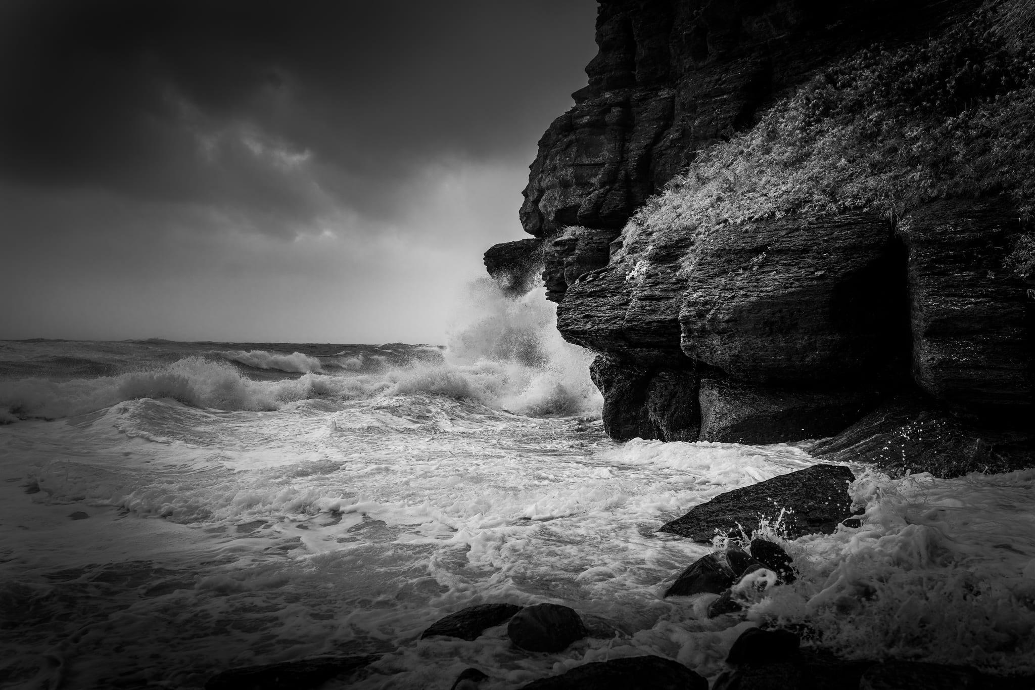 Cliffs and surf, in black and white